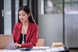asian-businesswoman-using-laptop-in-modern-office-2025-01-10-05-36-51-utc (1)