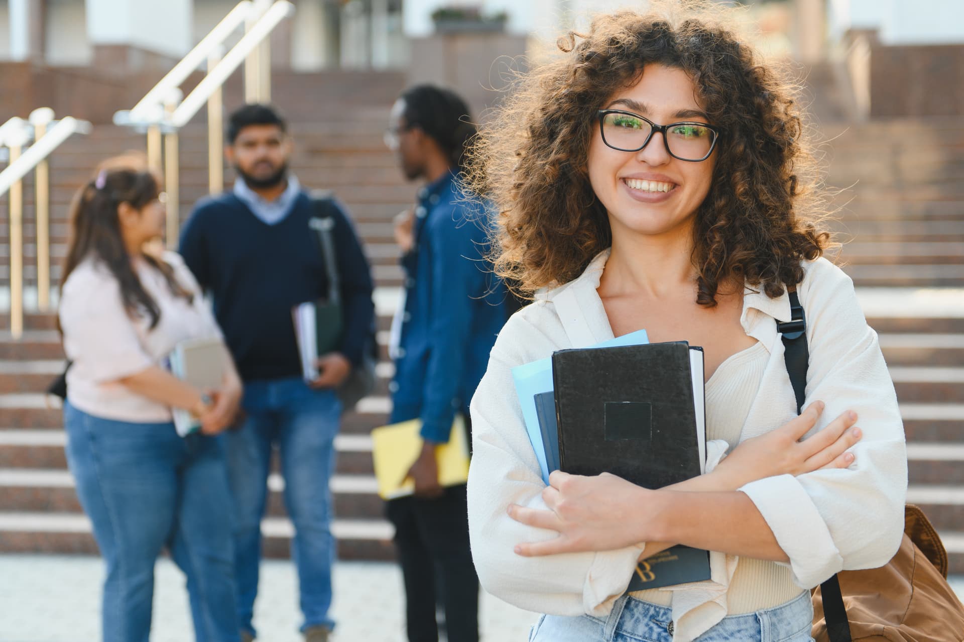 happy university student smiling on campus 2026 03 08 22 54 14 utc (1)