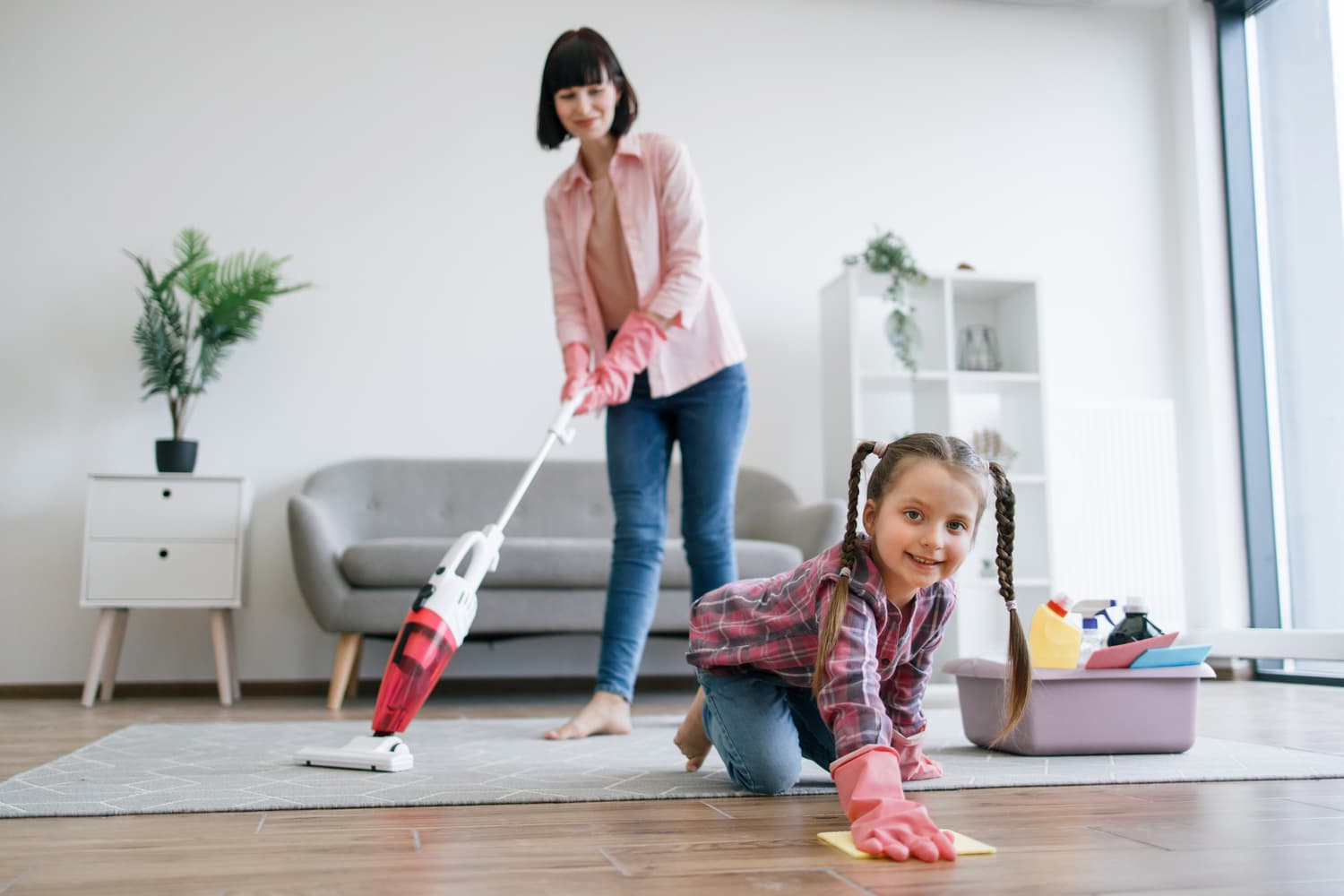 preteen kid cleaning floor while mom hoovering roo 2026 01 06 10 22 17 utc (1)