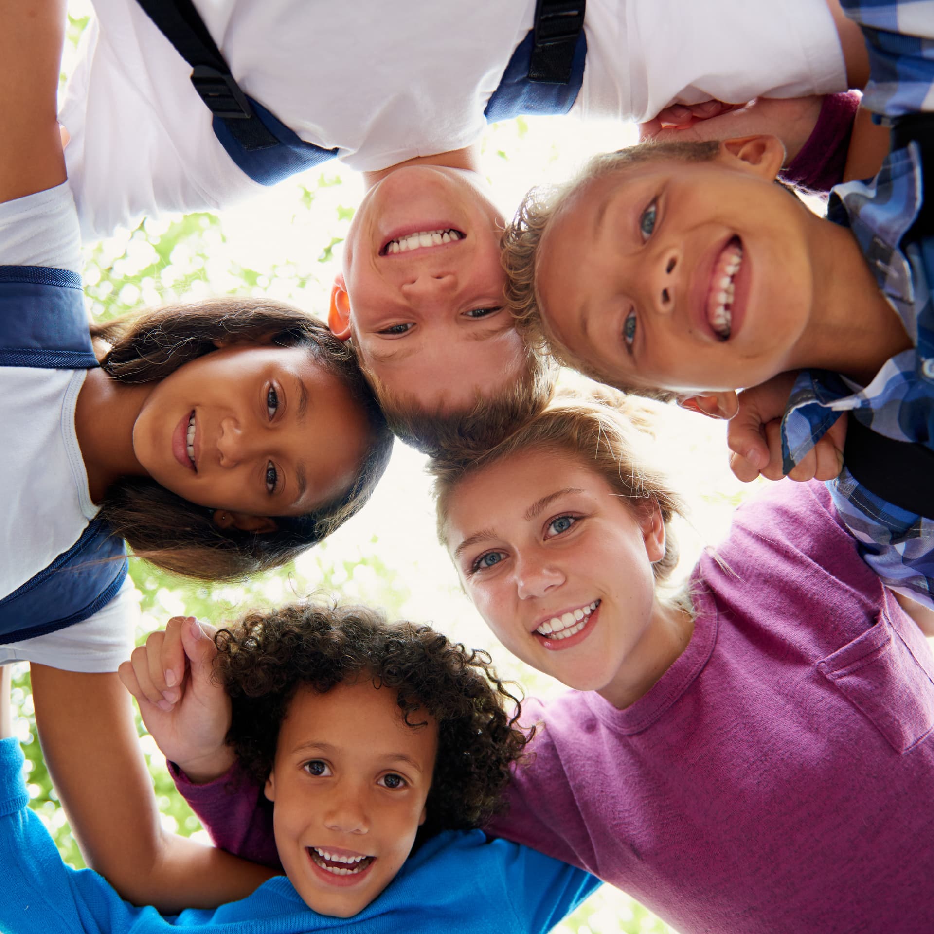 smiling children in circle looking down from above 2026 03 25 05 40 31 utc (1)